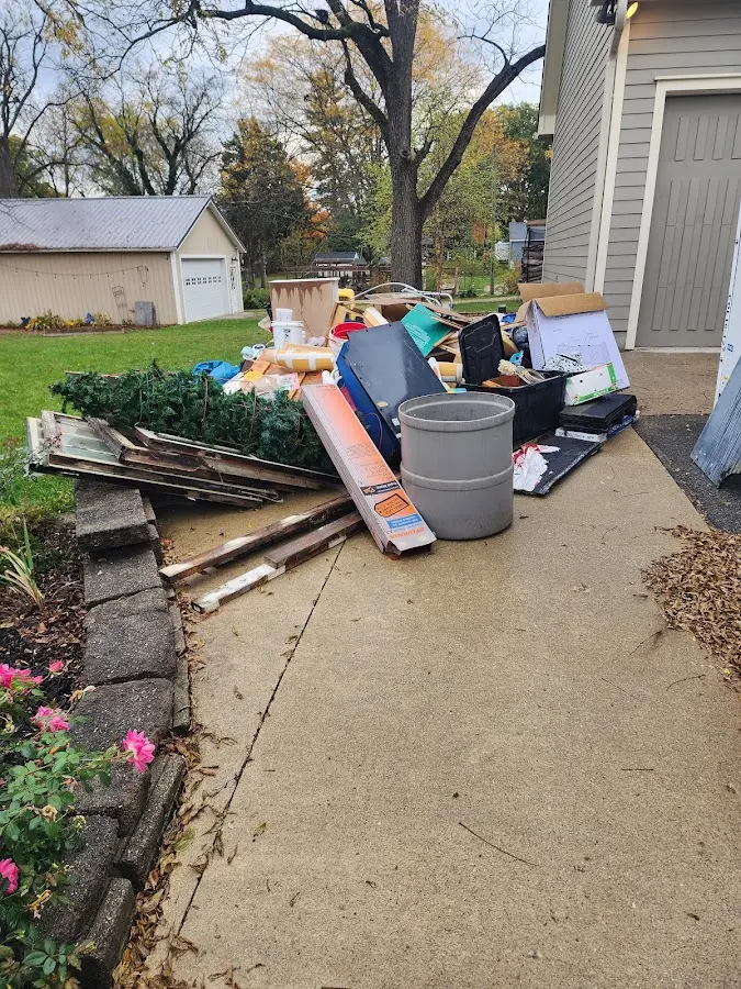Dumpster being loaded with debris for 10 Yard Dumpster Rental in Cecil
